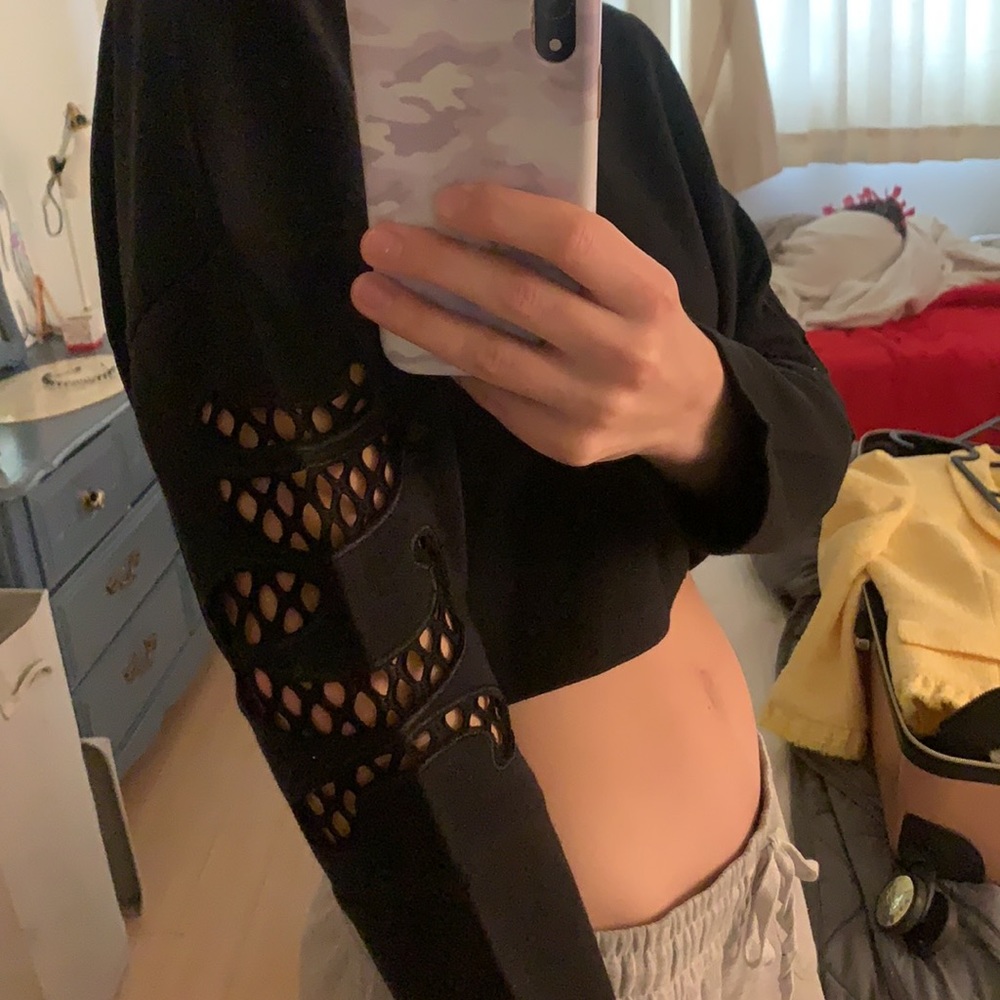 SOLD INA long sleeve fashion top with arm cutouts